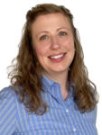 Woman with blue shirt and long wavy hair